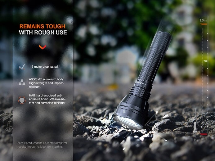 Fenix HT32 rechargeable LED flashlight with 2500 lumens brightness and red, green, and white light outputs for outdoor and hunting use